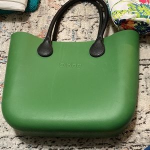 Green full size O Bag with handles and flower insert